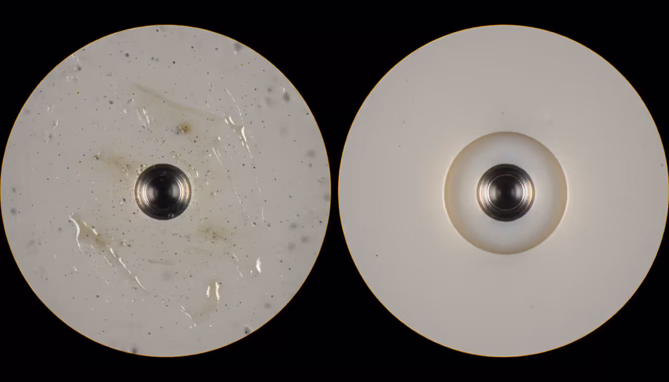 Side-by-side fiber optic connector end face microscope views comparing a contaminated ferrule with dust particles on the left and a perfectly clean polished ferrule on the right